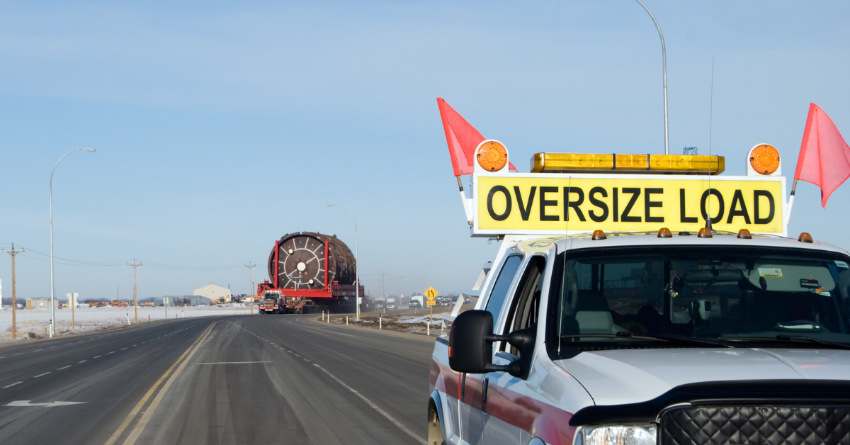 vehicle with oversized load sign driving on highway